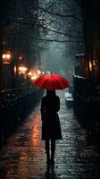 joven mujer con rojo paraguas en el lluvia foto