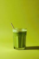Minimalism iced matcha tea in glass with straw isolated on green background. Space for text. Close up. Vertical orientation. AI Generative photo