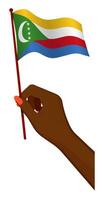 Female hand gently holds small flag of Comoros islands. Holiday design element. Cartoon vector on white background