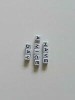 Have a nice day greeting text using alphabet beads photo