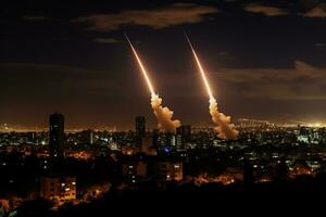 Iron Dome intercepting rockets over Israeli cities photo