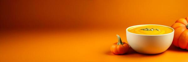 gastrónomo calabaza sopa con rústico adornar aislado en un degradado naranja antecedentes foto