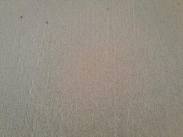 Texture of the sand on the East Java beach photo