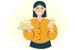 Happy young woman holding cake with candles using mobile mobile phone, isolated on plain background. Birthday concept vector