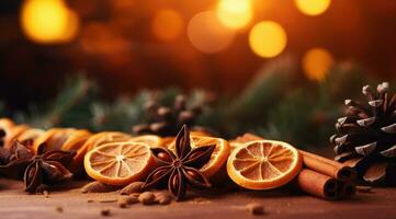 Traditional Christmas spices and dried orange slices on holiday light background. Christmas spices decoration photo