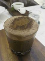 Dark chocolate latte in glass refreshment beverage drink photo