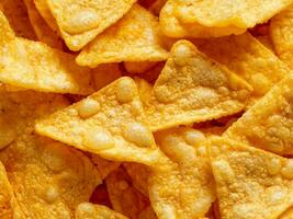 tasty corn chips with cheese, closeup. top view photo