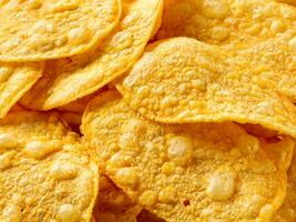 tasty corn chips with cheese, closeup. top view photo