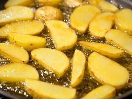 frying pan with fried potatoes. photo