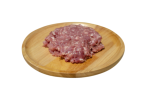 Raw fresh minced pork on a wooden plate on transparent background, side view png