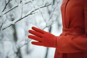 Woman hand in red gloves on winter outdoor. Generate Ai photo