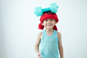 Asian boy in tank top doing exercise And there was a sweat towel on his head. photo