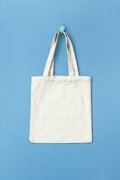 Tote bag hanging on hook. Mock up reusable bag. photo