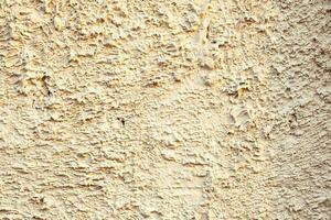 Rugged grungy plaster wall texture. photo