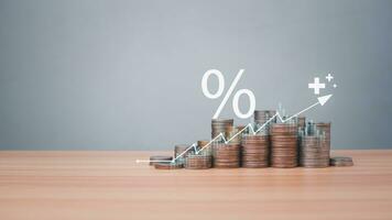 Coins are lined up on a wooden floor along with index charts, arrows and candlesticks. Represents financial, economic, business growth concepts. Financial success concept. Abstract finance background. photo