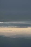 clouds over the sky by sunset photo
