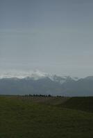 clouds over the mountains and farms photo