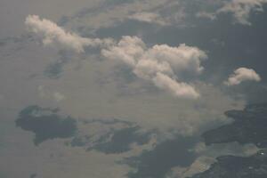 clouds over the sky and sea photo