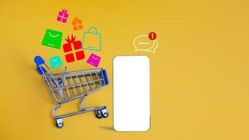 Shopping car and empty smartphone on yellow background. shopping online concept. photo