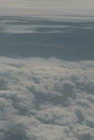 clouds over the sky and sea photo