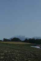 clouds over the mountains and farms photo