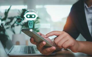 Businessman hand use show a smartphone to type live chat, ask, answer with an artificial intelligence system. chatbot. Ai assistant. photo