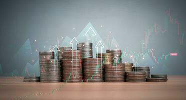 Coins are lined up on a wooden floor along with index charts, arrows and candlesticks. Represents financial, economic, business growth concepts. Financial success concept. Abstract finance background. photo