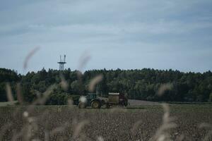 combine harvester working in a field photo