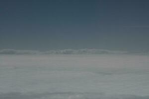 clouds over the sky and sea photo