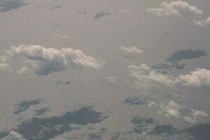 clouds over the sky and sea photo