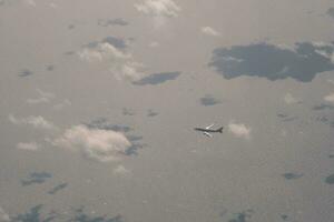 clouds over the sky and sea photo