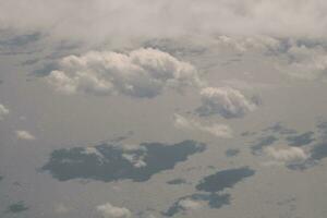 clouds over the sky and sea photo