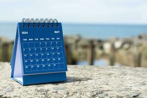 Blue August 2024 calendar on blurred background of blue ocean. New Year Concept photo