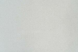 Gray background sheet of recycled cardboard. Close-up abstract texture carton photo