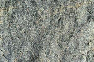 Stone surface grey color. Detailed nature background or pattern texture photo