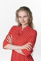 Portrait of sincere smiling young woman arms crossed over chest looking at camera, white background photo