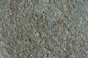 Gray volcanic sand, small colorful stone surface. Natural background or texture photo