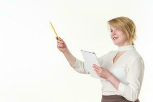 Caucasian ethnicity mature business woman holds clipboard pointing up finger with pencil. Copy space photo