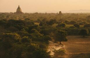 The beautiful landscape of Bagan plains the land of thousand pagoda in Bagan the first kingdom of Myanmar during sunset. photo