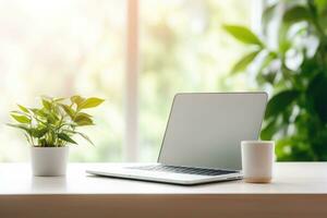 Minimalist simple office workspace with a laptop and a potted plant in soft natural light. Generative AI photo