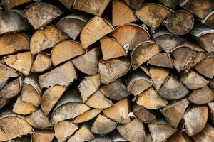 old firewood stacked in the woodpile photo