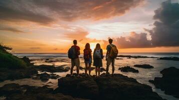 Captivating image of a group of travelers standing in awe of a stunning sunset photo