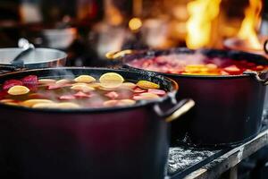 Beverages fruits and berries hot mulled wine in pots with steam in street food market. Generative AI photo