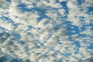 White clouds in a blue sky Abstract bacground photo