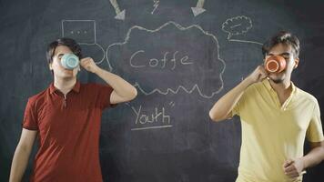 Young man writing Cafe on blackboard. video
