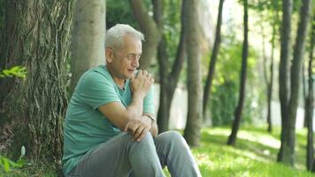 The man laughing to himself in the park went crazy. video