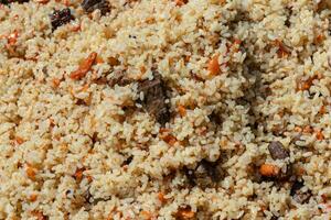 Traditional Eastern culinary dish - pilaf. Close-up view of Asian tasty food background photo