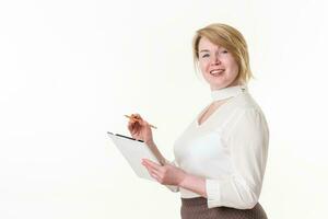 Friendly businesswoman conducting job interview. Employer woman writes on clipboard with pencil photo