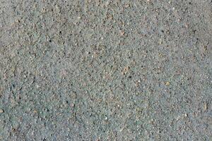 Gray volcanic sand, small stone surface. Detailed natural background or texture photo