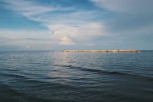 Landscape of sea and beach during sunset night time with vanilla sky photo